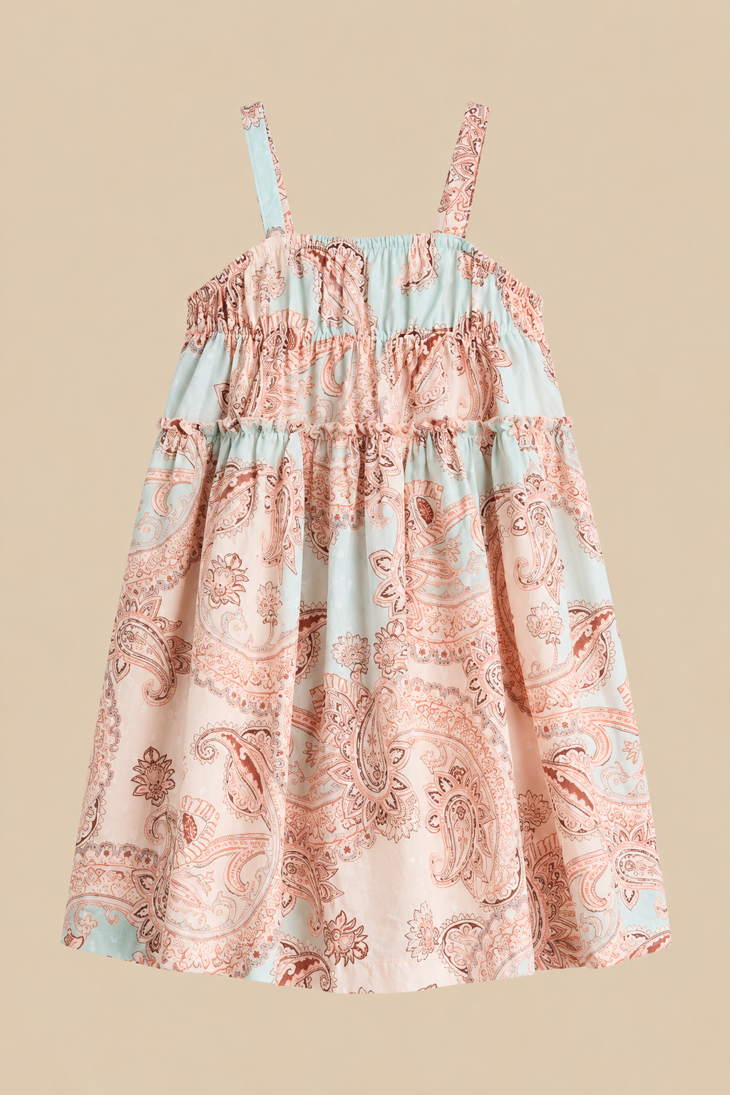 Flat lay of a sleeveless tiered sundress in pastel peach and mint paisley